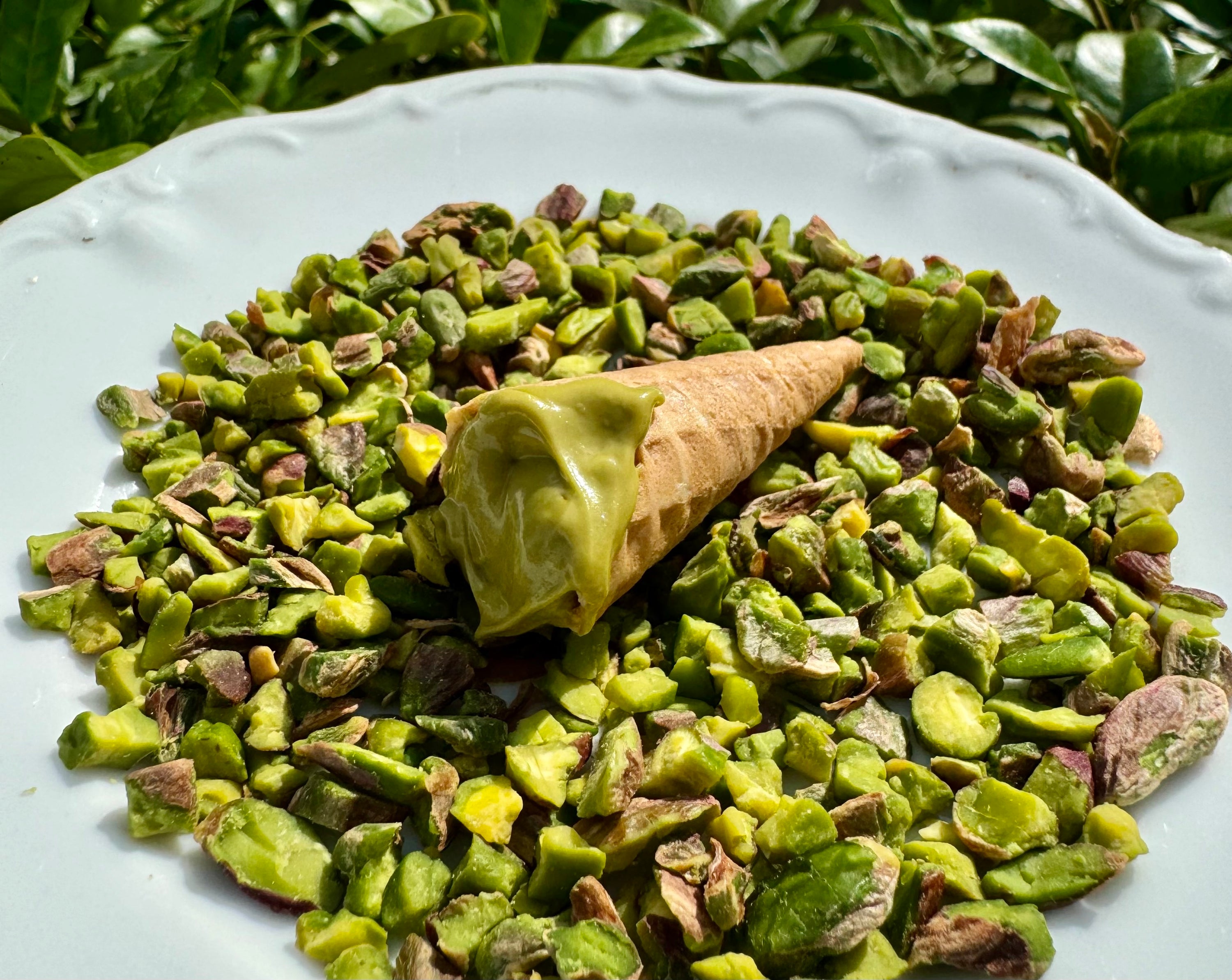 mini waffle cones filled with pistachio cream, showcasing a delightful and easy-to-make pistachio treat, perfect for snacking or dessert