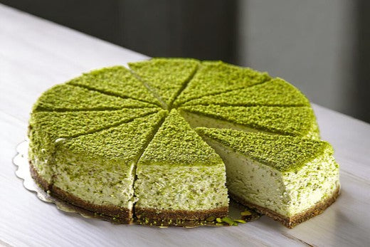 no-bake gluten-free pistachio cheesecake, featuring a creamy pistachio filling atop a crunchy gluten-free crust, garnished with chopped pistachios for a delicious and elegant dessert